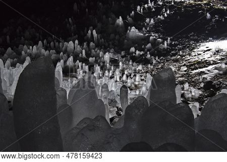 Russia. Kuril Islands. Cave With Numerous Ice Stalagmites On The Island Of Iturup. During The Time O