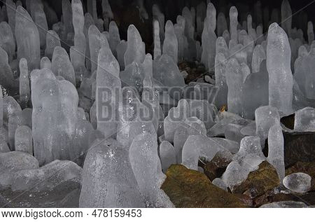 Russia. Kuril Islands. Cave With Numerous Ice Stalagmites On The Island Of Iturup. During The Time O