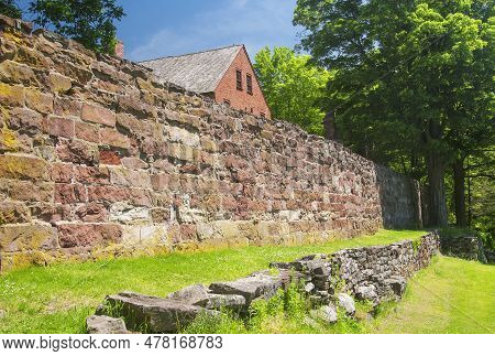 The Old Newgate Prison Wall And Building On A Sunny Blue Sky Day In East Granby Connecticut