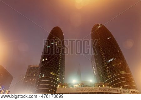 Dubai, United Arab Emirates - December 23, 2017: Damac Park Towers Architectural Structures At Night