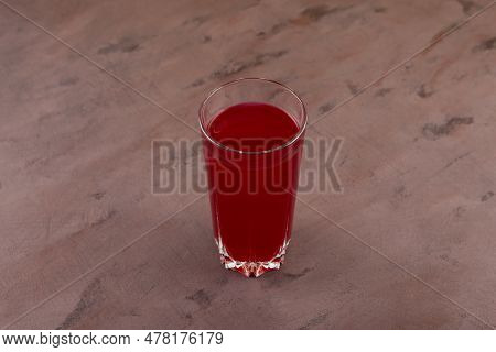 Glass Of Salgam Or Fermented Beet Juice On Brown Background, Selective Focus. Popular Turkish Drink.
