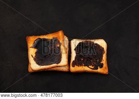 Roasted Aussie Savoury Toasts With Vegemite On Dark Background, Top View. Vegemite Is A Very Popular