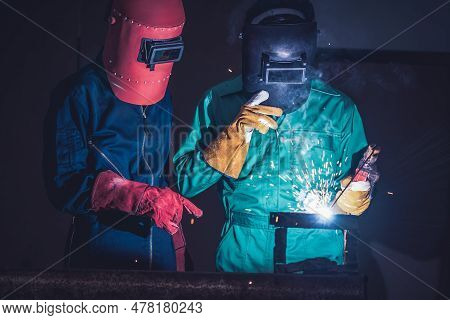 Metal Welding Steel Works Using Electric Arc Welding Machine To Weld Steel At Factory. Metalwork Man
