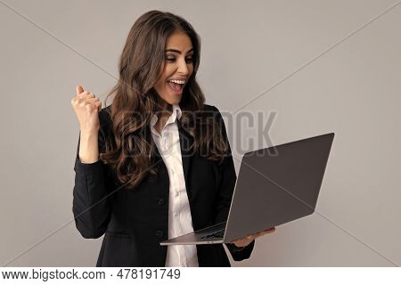 Beautiful Smiling Business Woman Over Grey Background Using Laptop Computer.