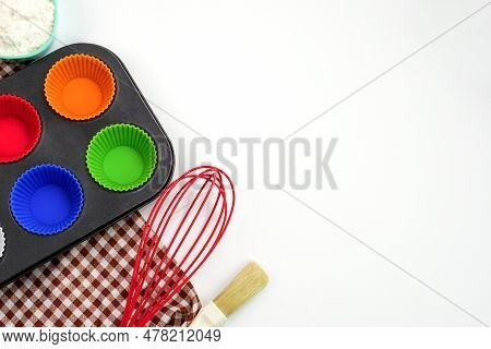 Top View Kitchenware Wooden Rolling Pin, Wooden Spatula And Egg Beater On White Background. Material