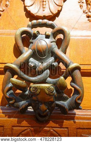 European Vintage Old Metal Wrought Iron Door Knocker. Design Detail. Paris.