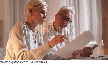 Couple Debt. Financial Bills. Woman Man With Document Planning Family Budget For Month Counting Mone