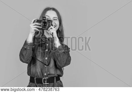 Happy Kid Photographer Looking Into Camera While Photographing Yellow Background, Copy Space