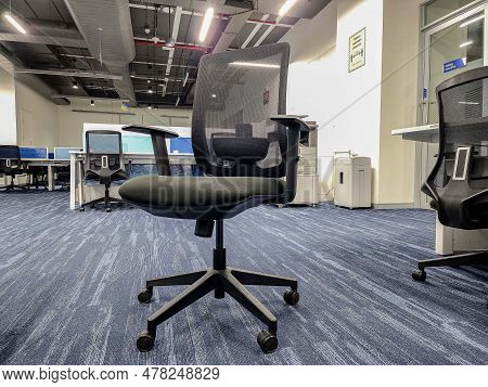 Hyderabad, India- December 23rd 2022; Stock Photo Of A Comfortable Black-colored Mid-back Ergonomic 