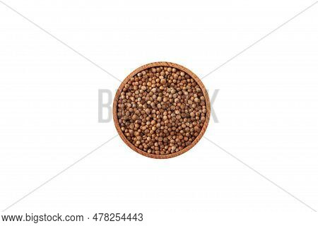 Dried Coriander Seeds In In Wooden Bowl Isolated On White Background. Top View, Copy Space.