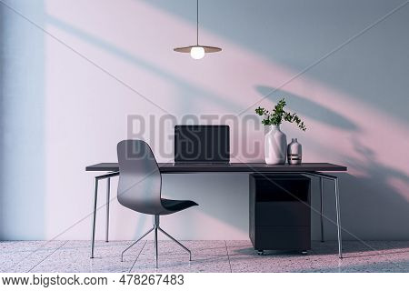 Contemporary Home Office Interior With Computer, Furniture And Other Items. Concrete Wall With Shado