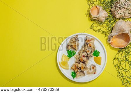 Pickled Rapan Meat With Oil, Spices And Greens. Healthy Seafood Rich Of Omega