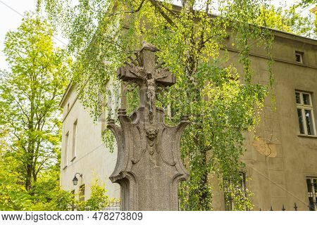 A Stone Cross Standing Close To The Cathedral Basilica. Place Of Death Of Father Zygmunt Maslowski. 