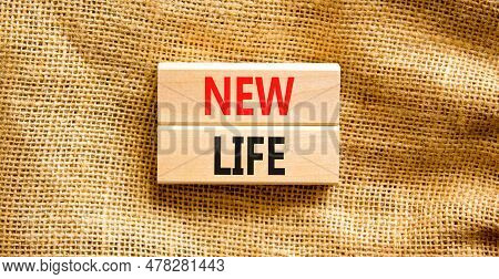 New Life Symbol. Concept Words New Life On Wooden Blocks On A Beautiful Canvas Table Canvas Backgrou