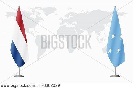 Netherlands And Micronesia Flags For Official Meeting Against Background Of World Map.