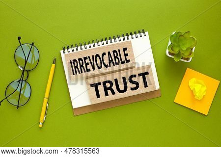 Words Irrevocable Trust On A Green Beautiful Background. Business, Finance.