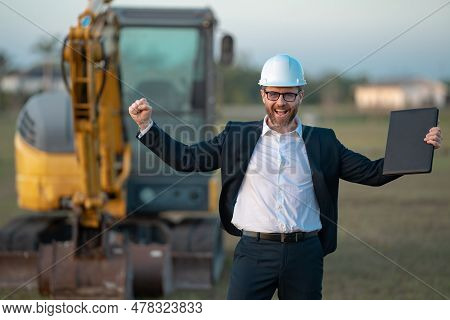 Construction Business Owner. Man In Suit And Hardhat Halmet At Building Construction Site. Civil Eng