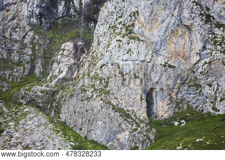 Source Of The River Deva. Small Waterfall In The Picos De Europa