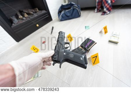 Close Up On Hands Of Unknown Man Forensic Police Investigator Collecting Evidence In The Plastic Bag