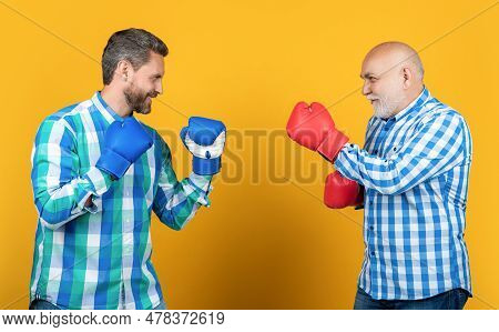 Happy Generation Men Boxing In Studio. Generation Men Boxing On Background.