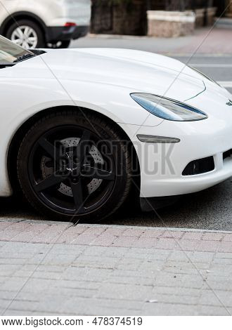Minsk, Belarus, June 2023 - White Chevrolet Corvette Z06  Sportscar Is Parked In Street