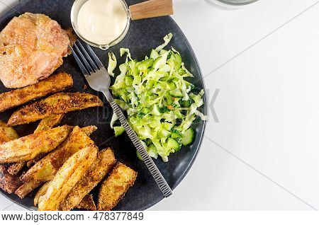 Fried Chiken Meat With Baked Potatoes In Spices And Salad On Plate For Tasty Lunch. Baked Chiken Wit