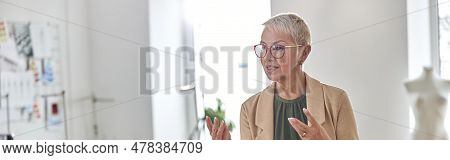 Fashion Designer With Glasses And Pin Pillow In Wrist Shoots Vid