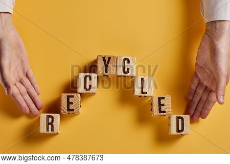 Recycled Word Written On Wood Block. Recycle Text On Cement Table For Your Desing, Concept