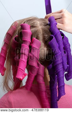Soft Curler Spirals Or Long Curlformers On Back Of The Head Little Girl. Fashion Accessory For Frizz