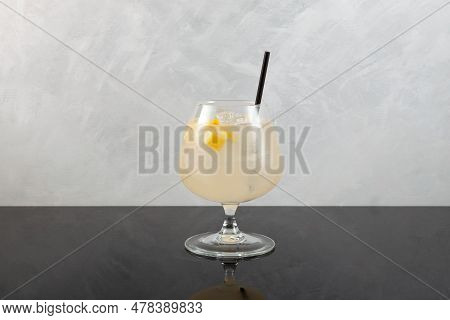 Pomada Drink On Grey Background. Refreshing Summer Iced Cocktail With Gin And Lemonade. Selective Fo