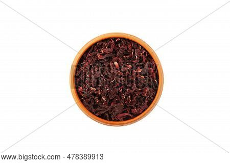 Dried Hibiscus Petals Or Hibiscus Sabdariffa In Clay Plate, Top View. Karkade Petals Used To Make De