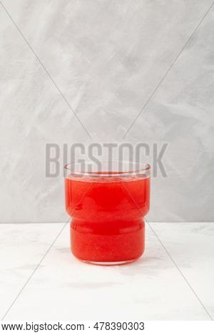 Glass Of Watermelon Smoothie Or Watermelon Juice On Grey Background. Jus Semangka.