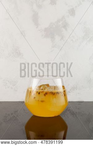 Glass Of Yuzu Iced Fizzy Lemonade With Passion Fruit And Orange Juice. Refreshing Iced Drink. Fruit 