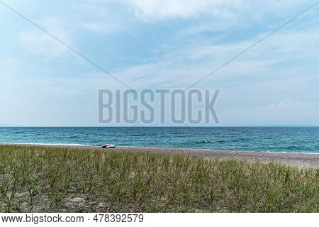 Two Singke Kayak On Shore Of Superior Lake, Canada