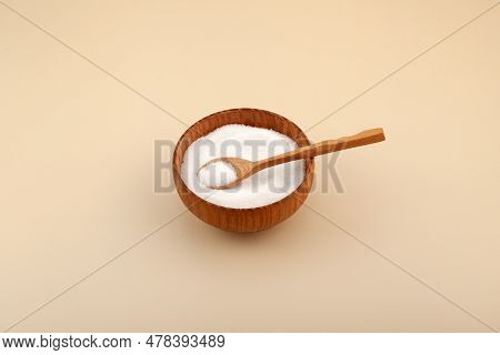 Isomalt Or Isomaltitol  Powder In Wooden Bowl. Food Additive E963, Sweetener. Isomalt, Sugar Substit