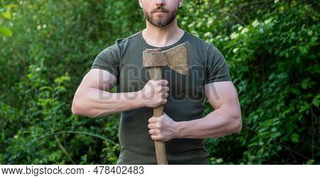 Cropped View Of Man With Ax Wearing Shirt. Man With Ax Outdoor. Photo Of Man With Ax. Man With Ax