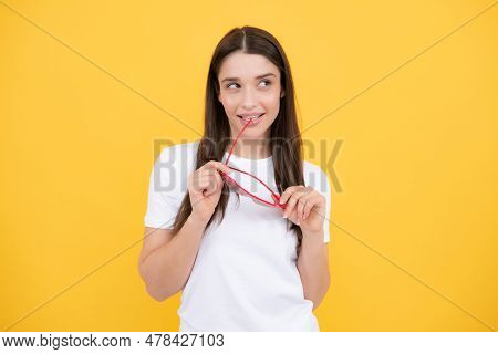 Cheerful Girl In Large Bif Funny Party Glasses Sunglasses. Portrait Of Young Woman Wearing Funny Gla