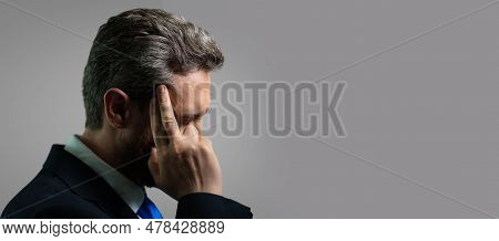 Millennial Businessman Having Headache. Business Man In Suit Suffer From Migraine Or Headache. Tired