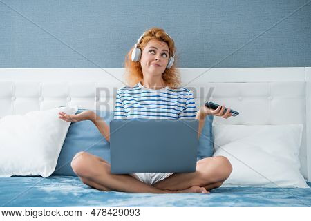 Skeptical Girl Freelancer Has Remote Work. Remote Working Girl Freelancer At Home. Freelancer Girl