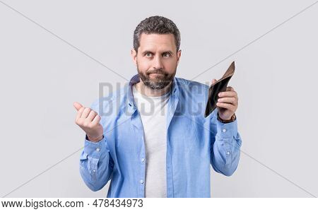 Photo Of Needy Moneyless Guy With Wallet. Moneyless Guy With Wallet Isolated On Studio