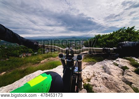 From The First Person Handlebars Of A Bicycle On A Race Through An Unpopulated Landscape. Close-up O