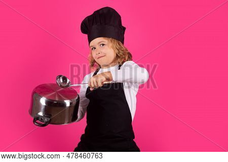 Fynny Kid Chef Cook With Cooking Pot And Ladle. Chef Kid Boy Making Healthy Food. Portrait Of Little