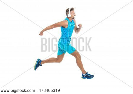 The Jogger Stretched Legs Before Running. Sport Jogger Listen To Music In Headphones. The Jogger Ran