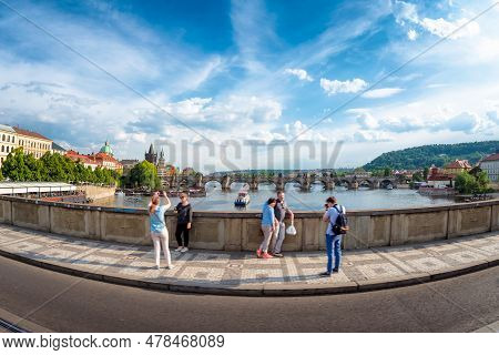 Undefinable Tourists Taking Pictures At Manes Bridge (manesuv Most). Prague, Czech Republic