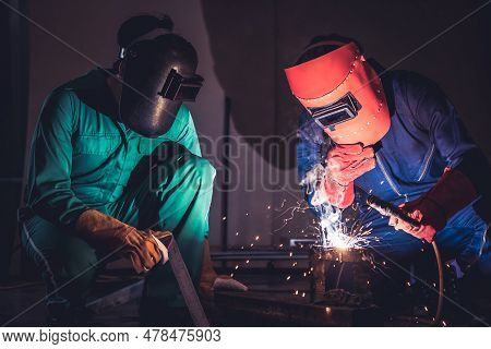 Metal Welding Steel Works Using Electric Arc Welding Machine To Weld Steel At Factory. Metalwork Man