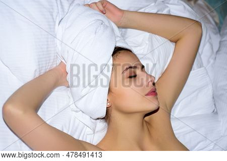 Portrait Of Young Sensual Beautiful Woman On Bed. Sexy Woman With Towel On Hed Enjoying Morning Life