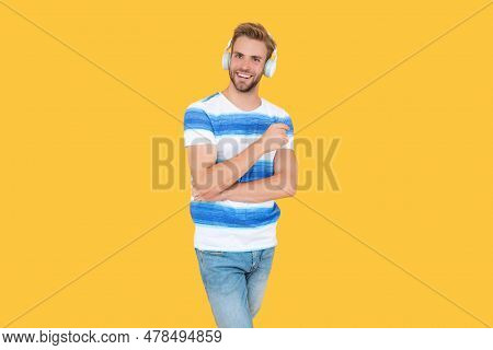 Millennial Lifestyle Man Smile Wearing Headphones To Listen To Music Or Audio Estudy Isolated On Yel