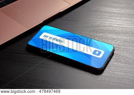 Voice Search And Speech Recognition With Stunning Close-up Of Smartphone With Voice Search Bar On Th