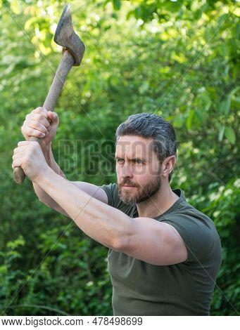 Caucasian Man Hit With Axe Outdoor. Photo Of Man Hit With Axe. Man Hit With Axe. Man Hit With Axe