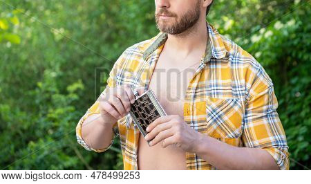 Photo Of Man With Bourbon Hipflask, Copy Space Banner. Man With Bourbon Hipflask.